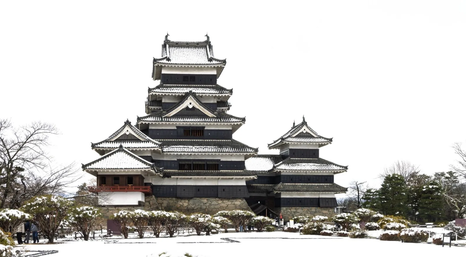 Matsumoto Castle's black-and-white keep dusted with snow in winter