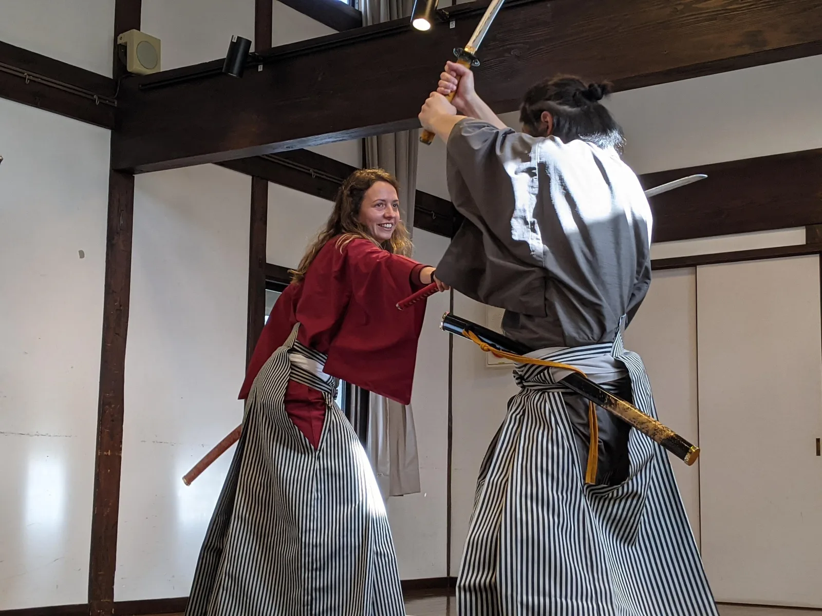 Climbing the original steep wooden stairs inside Matsumoto Castle